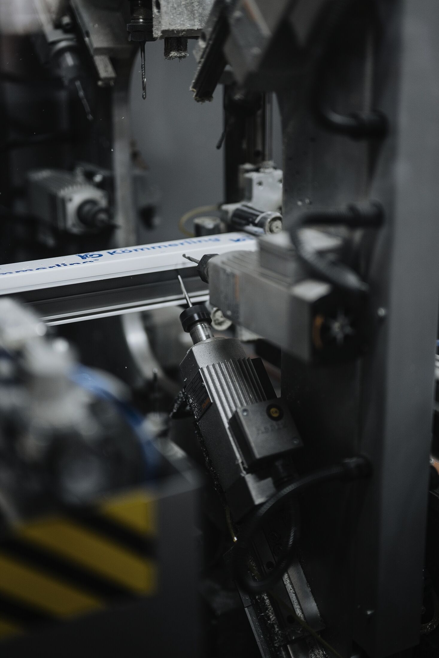 Industrial production equipment forming metal components in a factory (illustrative process photography, not a Kestrel facility)