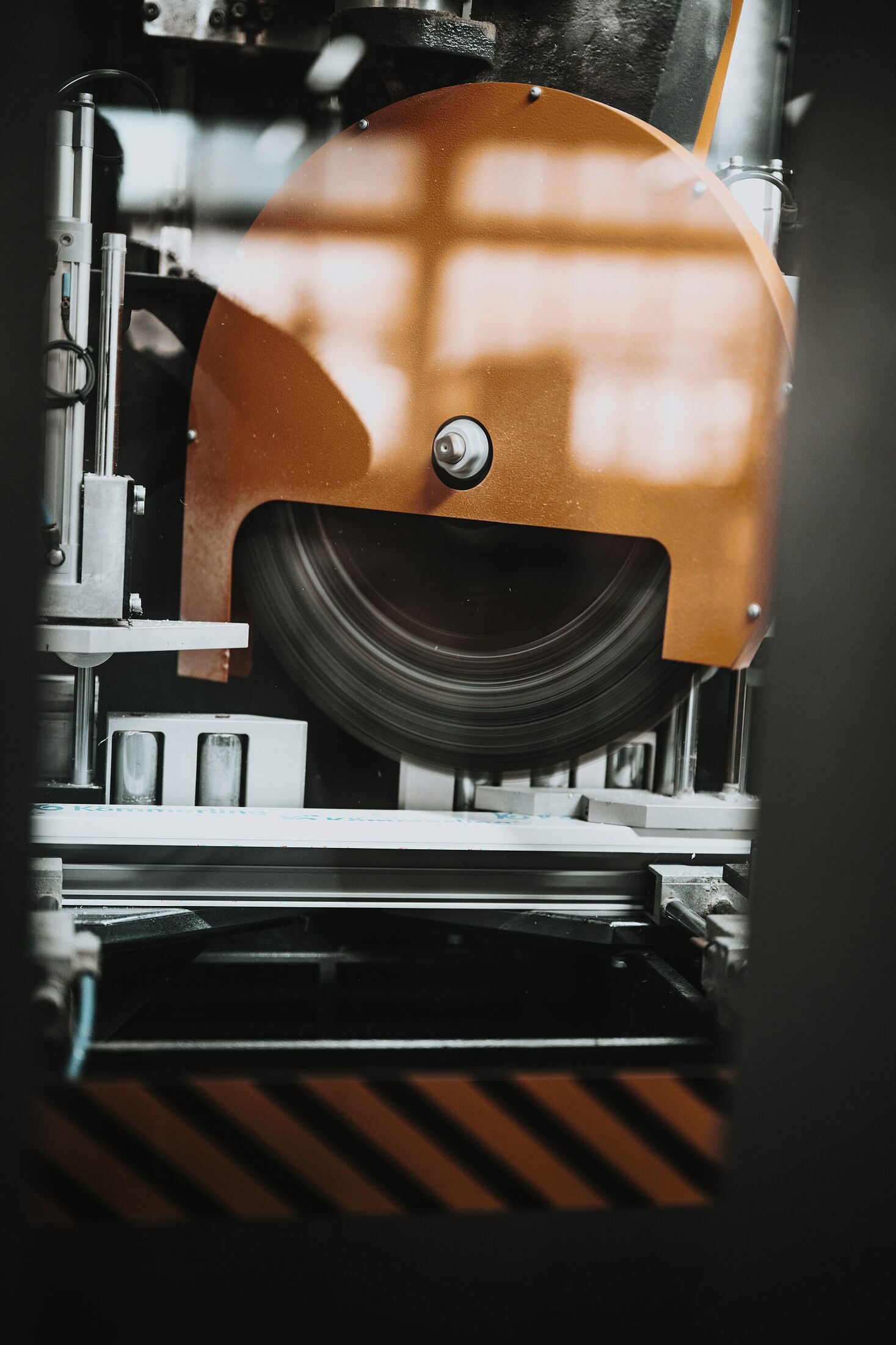 Machine tool cutting metal stock on a production line (illustrative process photography, not a Kestrel facility)